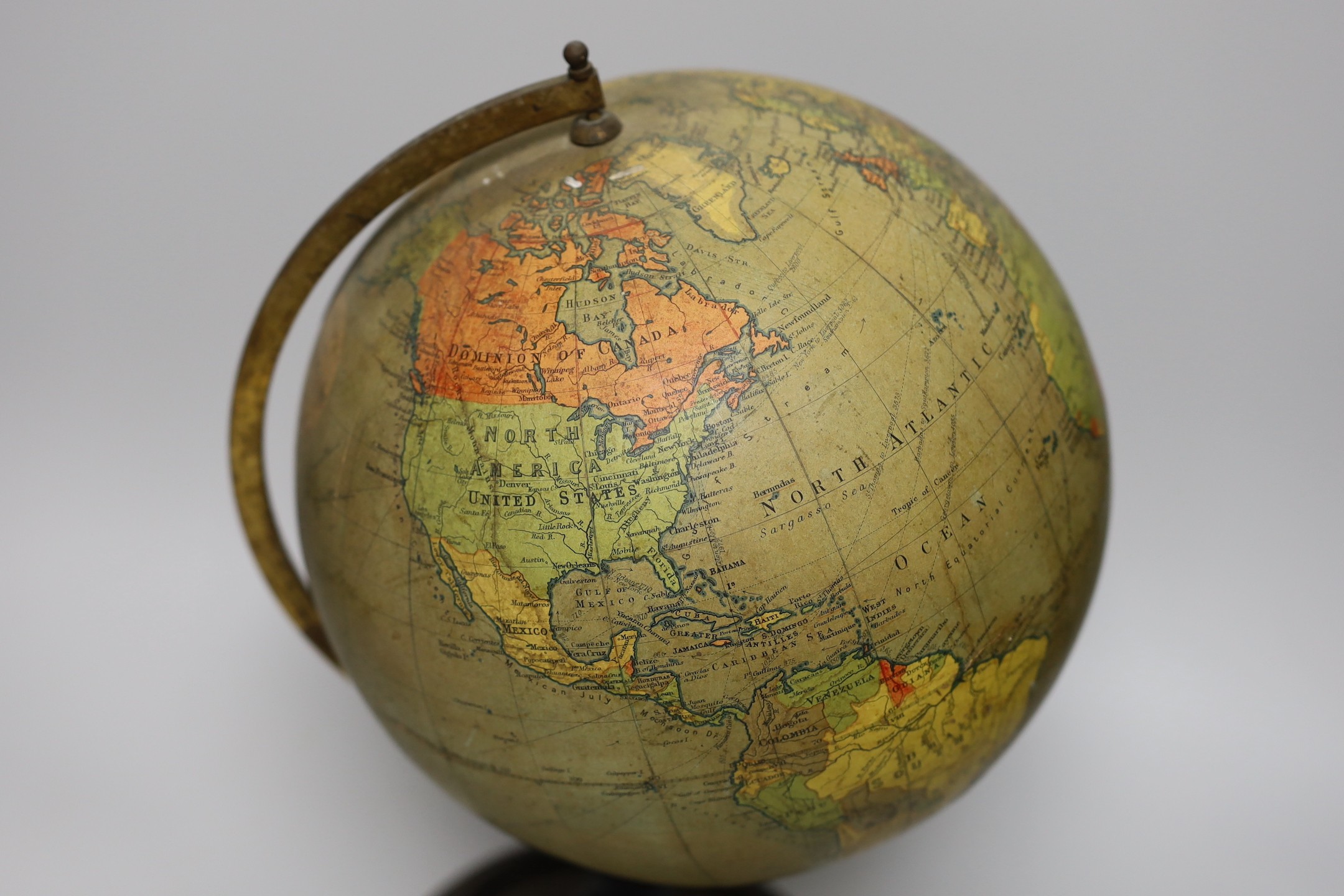 An Edwardian Philip’s 9 inch terrestrial globe, printed in Great Britain by George Philip and Son, 42cms high